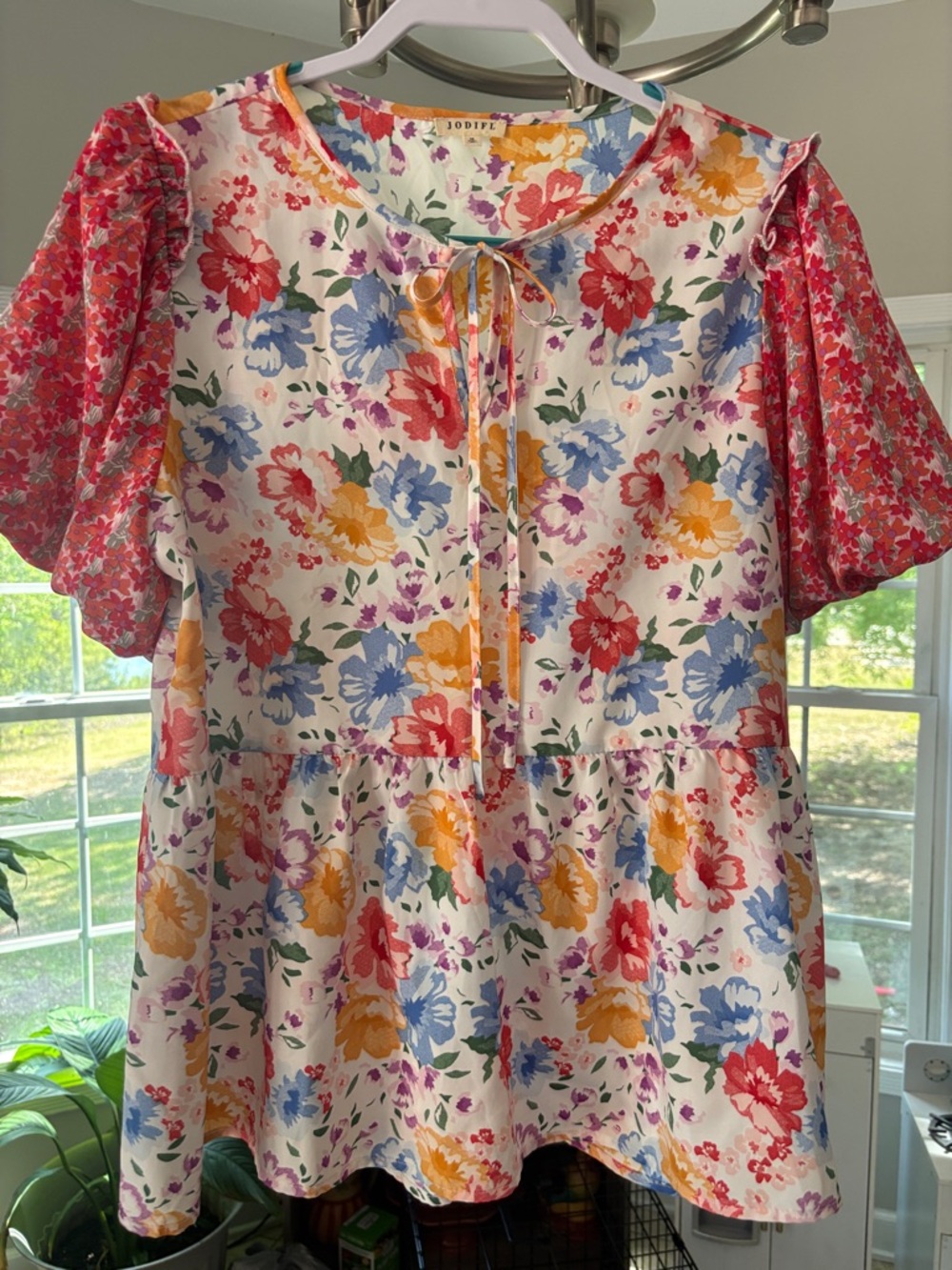 JODIFL White Floral Tie-Neck Peplum Top with Orange Puff Sleeves